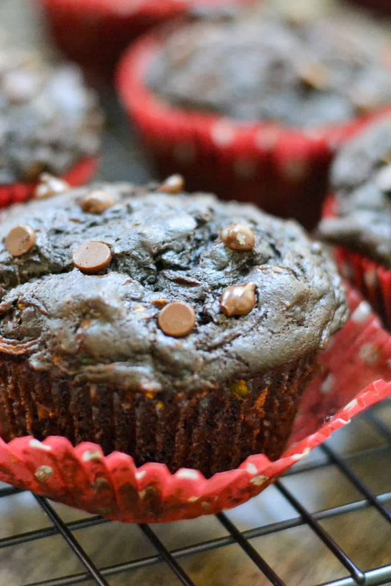 close-up shot of double chocolate vegan zucchini muffins with mini chocolate chips on top