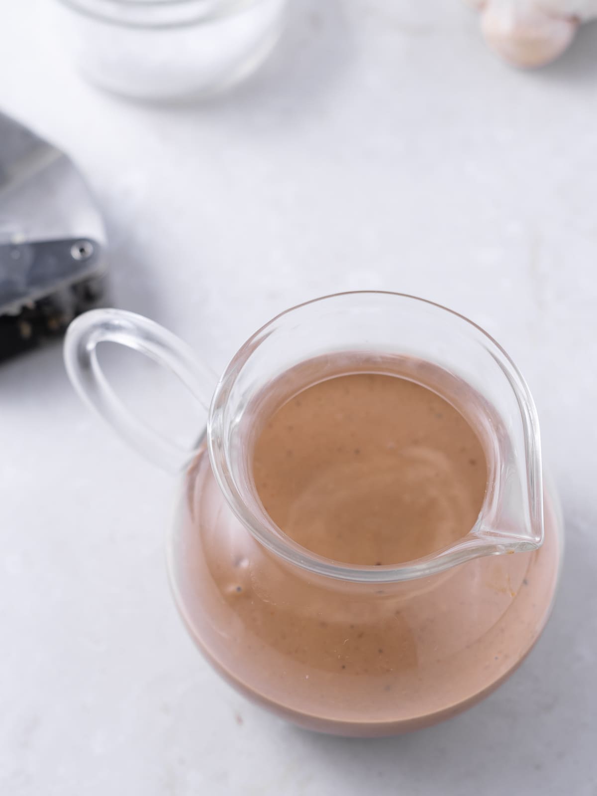 small glass teapot with balsamic fig dressing