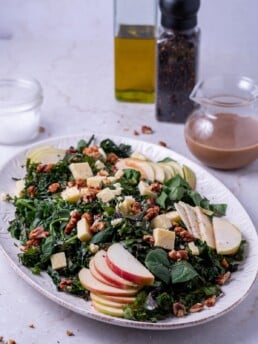 Platter of kale and spinach salad with balsamic fig dressing