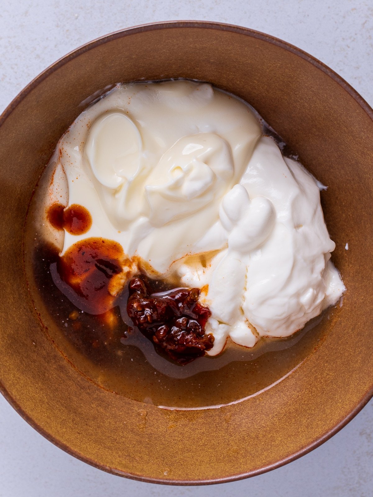 mayo, sour cream, lime juice and chipotle peppers in adobo sauce in a small bowl
