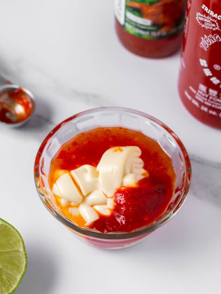 small bowl of sweet chili sauce, mayo and sriracha
