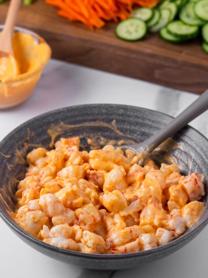 shrimp pieces coated in creamy sriracha sauce