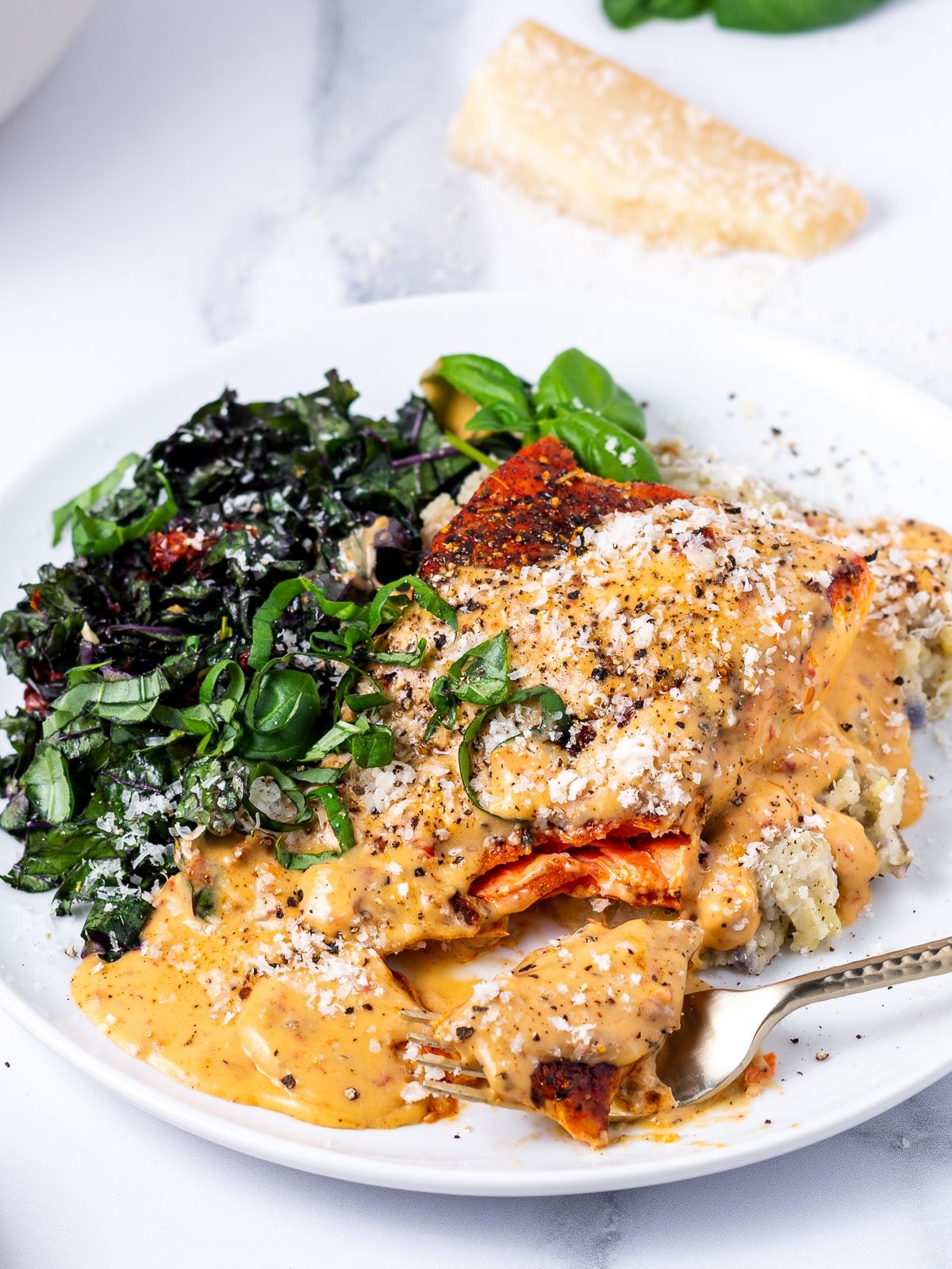 plate of marry me salmon with a bite on a fork