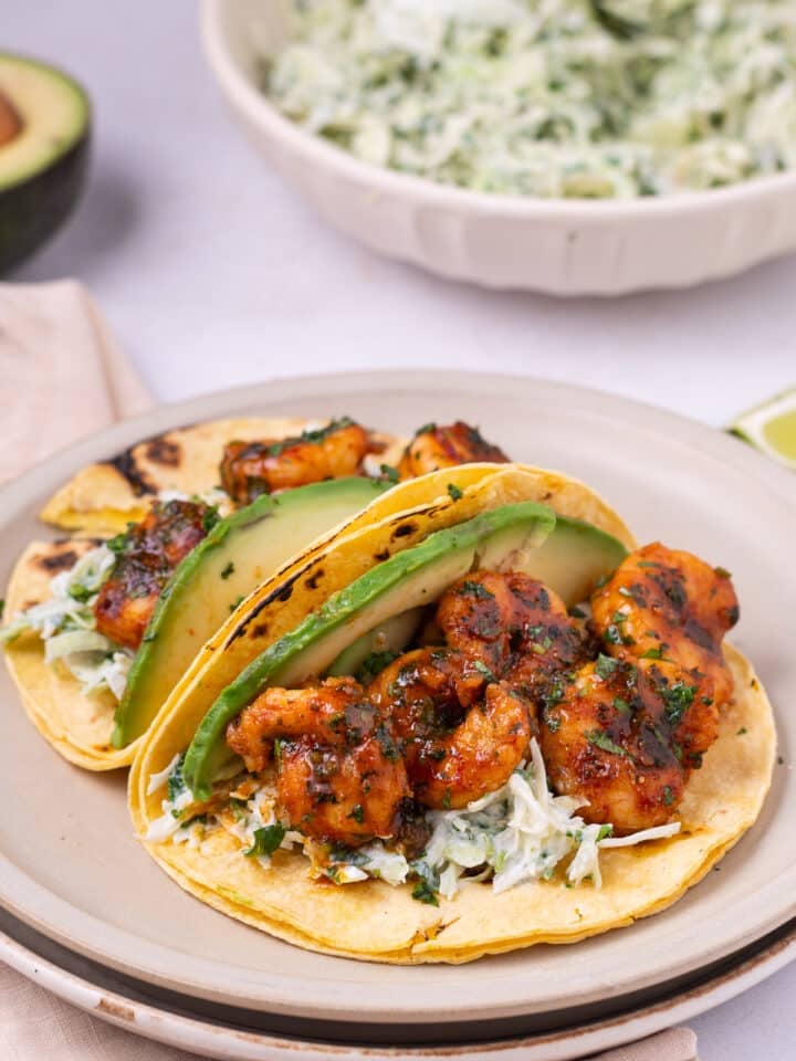 plate with two cilantro lime shrimp tacos