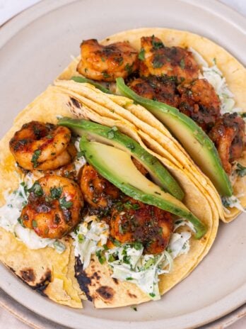 plate with two cilantro lime shrimp tacos