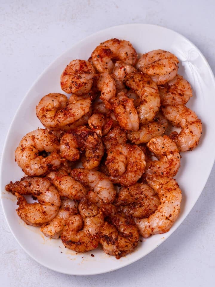 white plate with seasoned shrimp