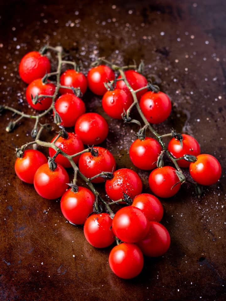 sheet pan with raw tomatoes on it