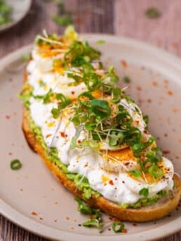 sourdough toast with avocado, cottage cheese, eggs and green onions