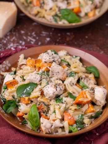 small plate with boursin orzo, chicken, sweet potatoes and chicken