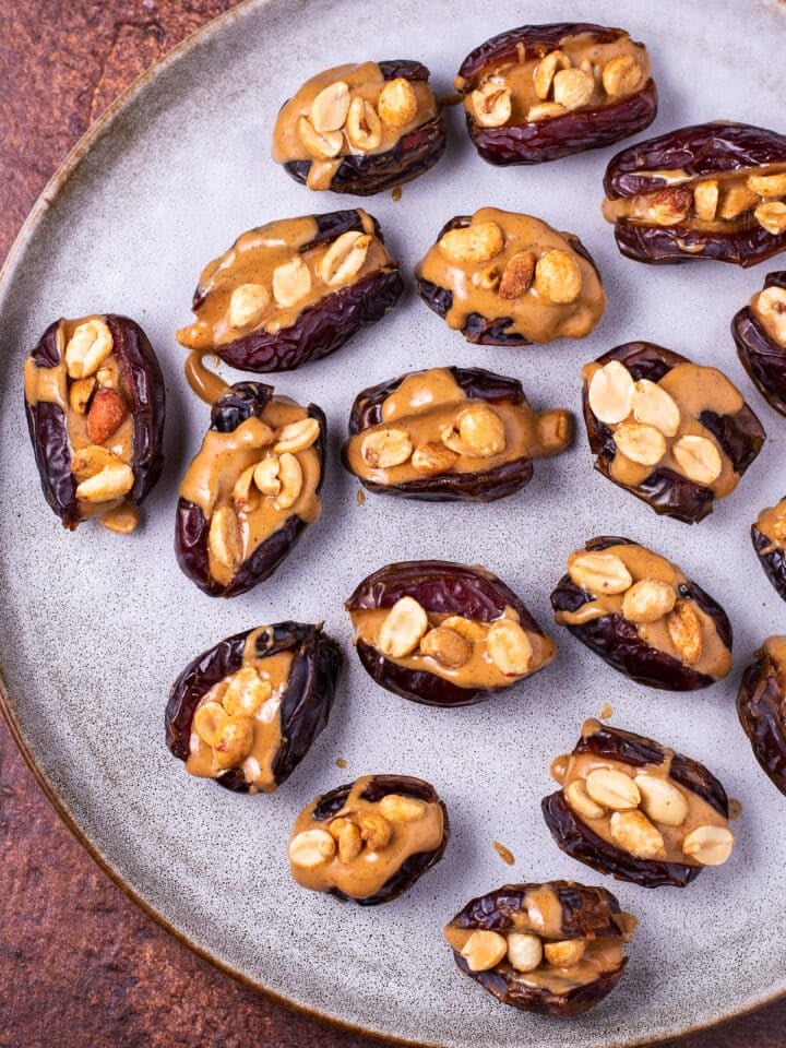 peanut butter filled dates on a plate