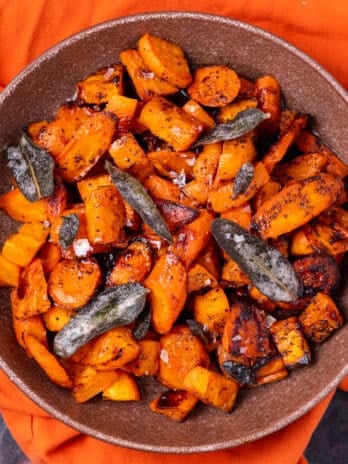 large bowl with roasted sweet potatoes and carrots with crispy sage and browned butter