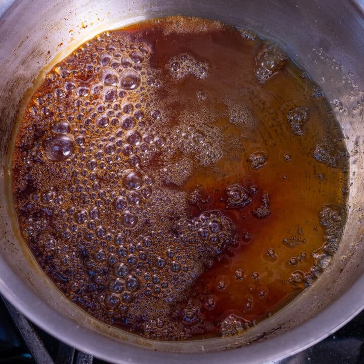 amber-colored boiling sugar in a saucepan