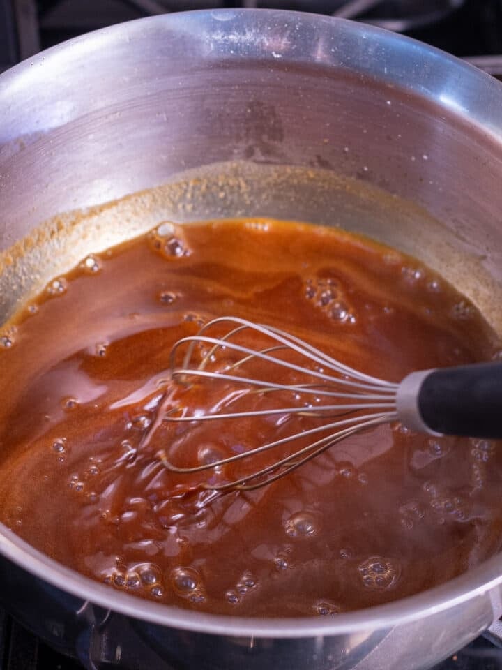 whisking the salt and vanilla extract into the salted caramel syrup