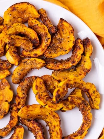 white plate with air fried delicata squash