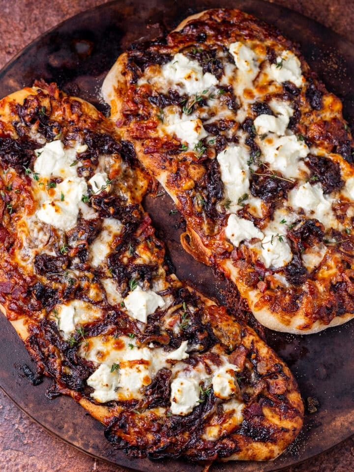 baked caramelized onion flatbread on a pizza stone