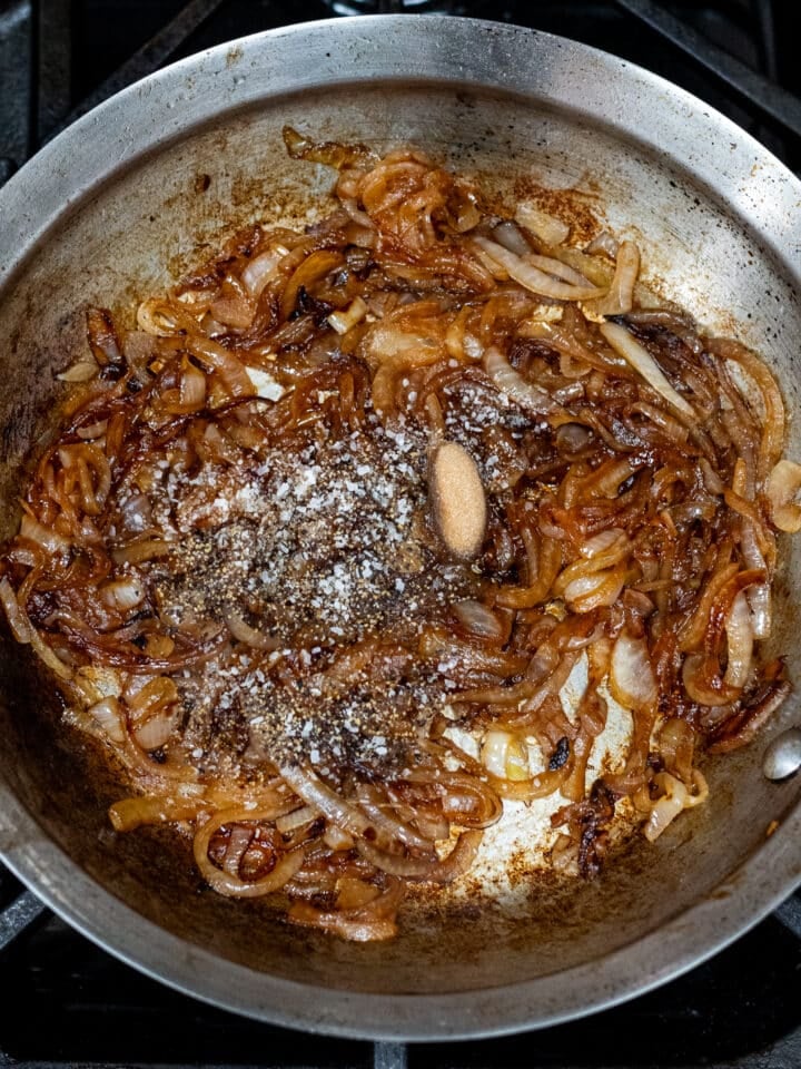 salt, pepper and brown sugar added to caramelized onions