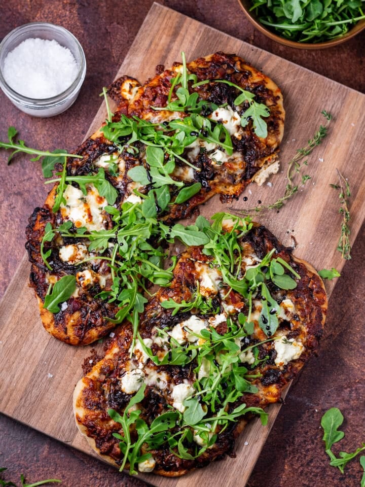 arugula and balsamic glaze on finished flatbreads with a pinch of flaky sea salt