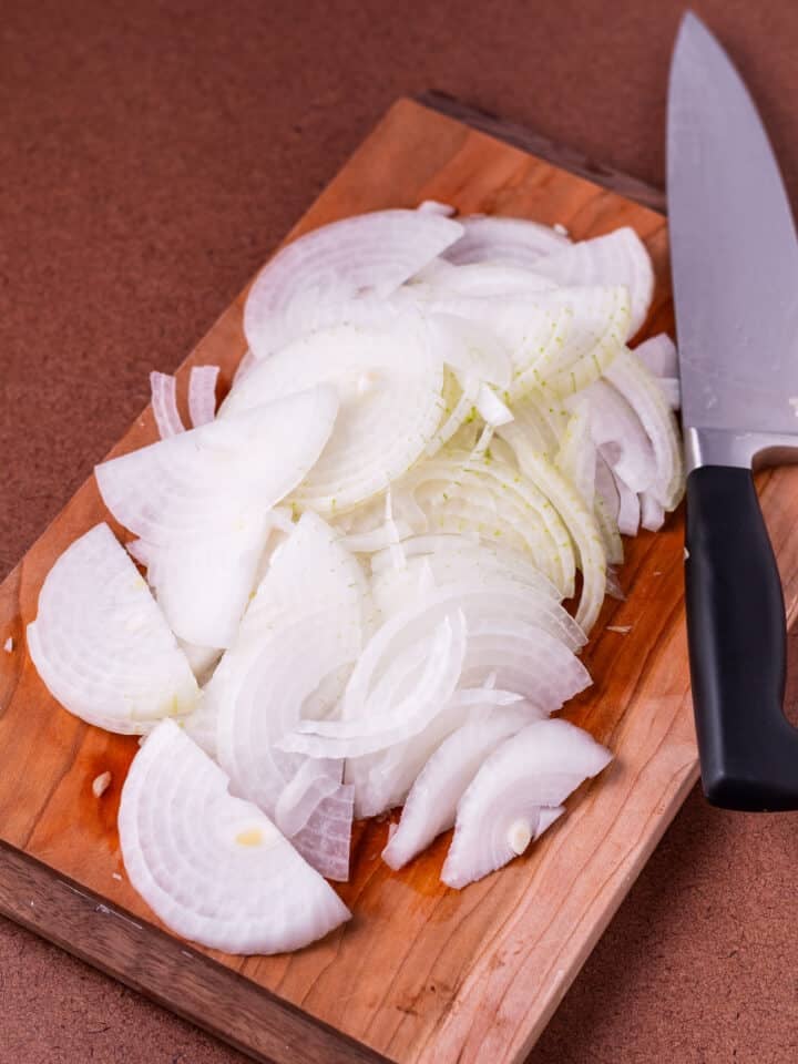 cutting board with sliced onions