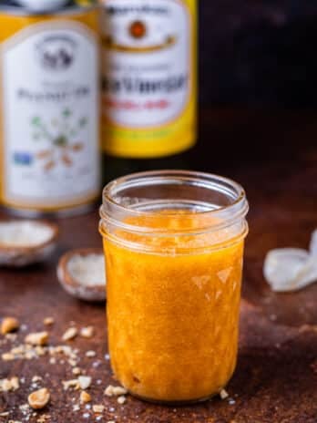 small jar with roasted peanut vinaigrette