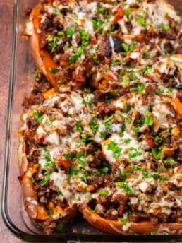 clear baking dish with stuffed sweet potatoes