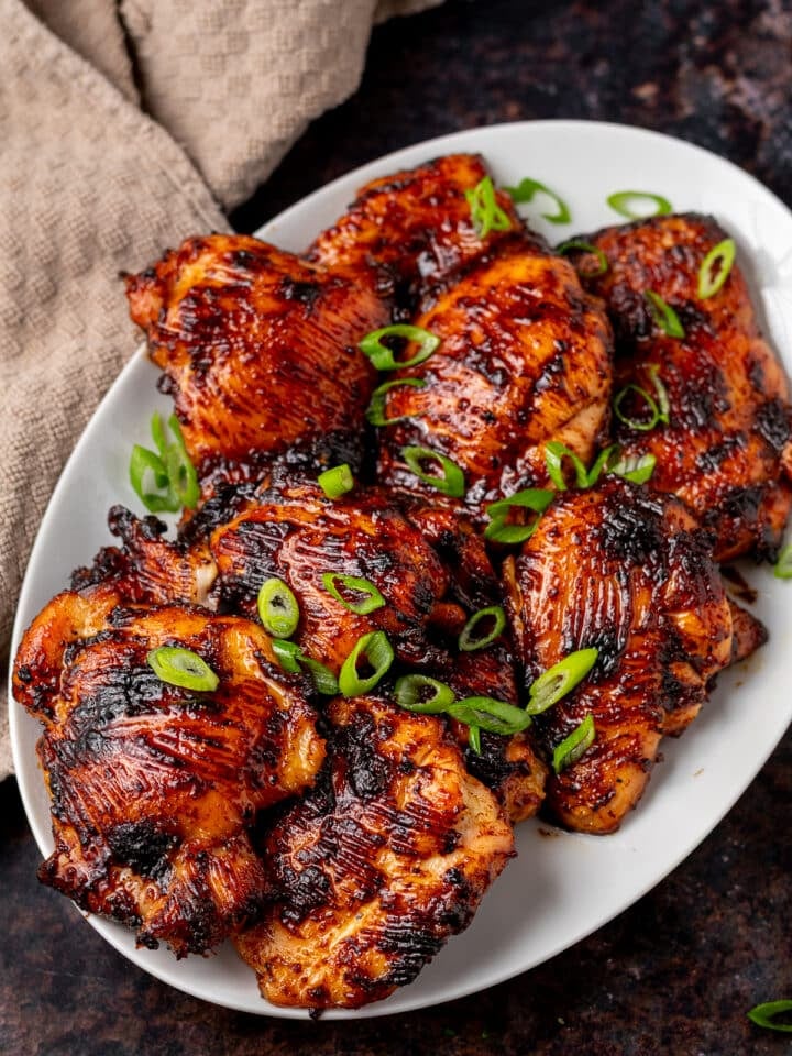 miso glazed chicken thighs on a large white platter