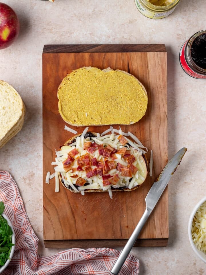 crumbled bacon placed on top of the cheese