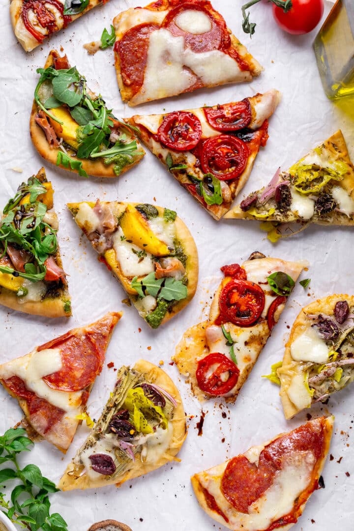 picture of four different varieties of naan pizza