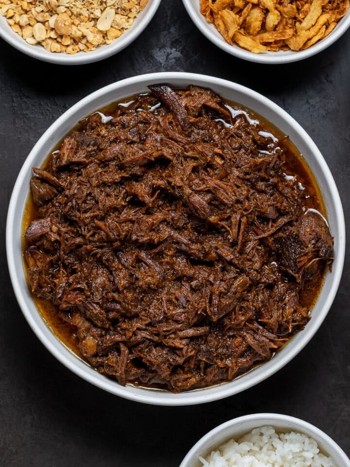 large white bowl with juicy, Korean shredded beef