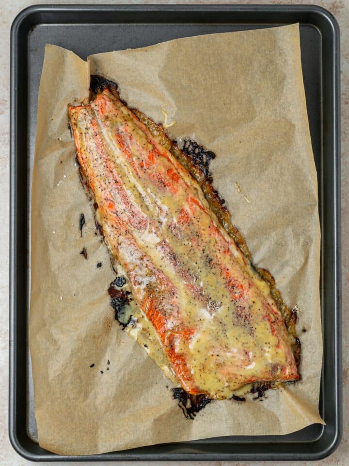 baked salmon on a piece of parchment paper