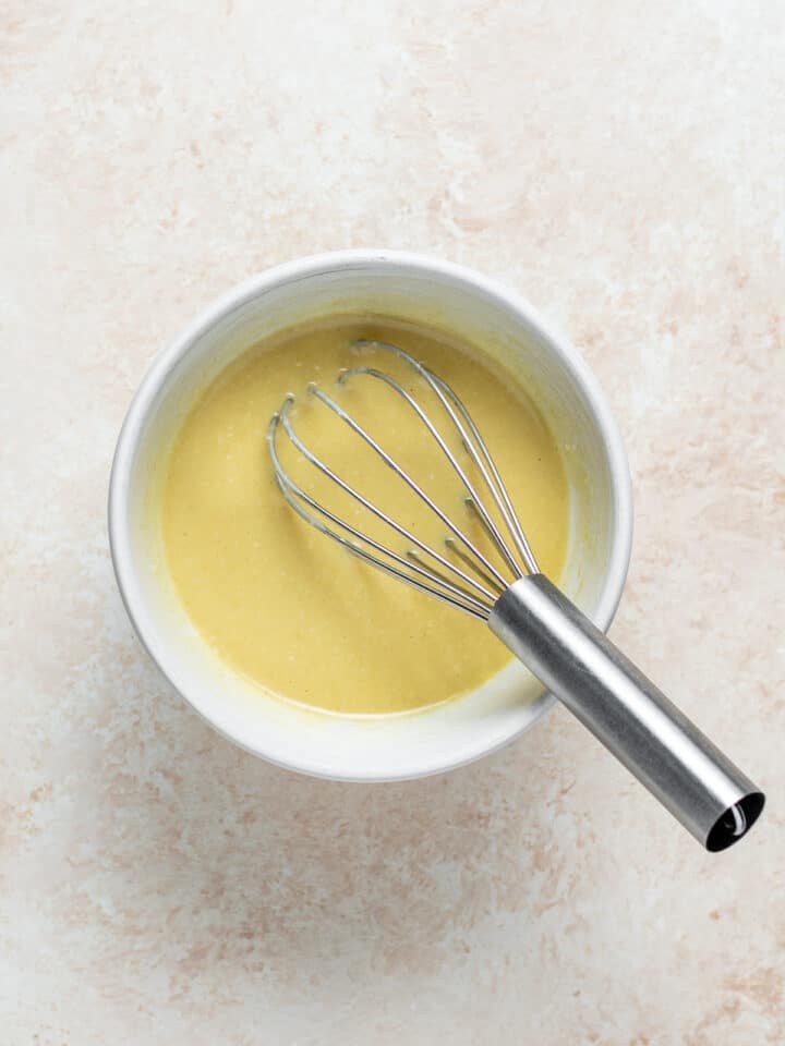 glaze whisked together in a small white bowl