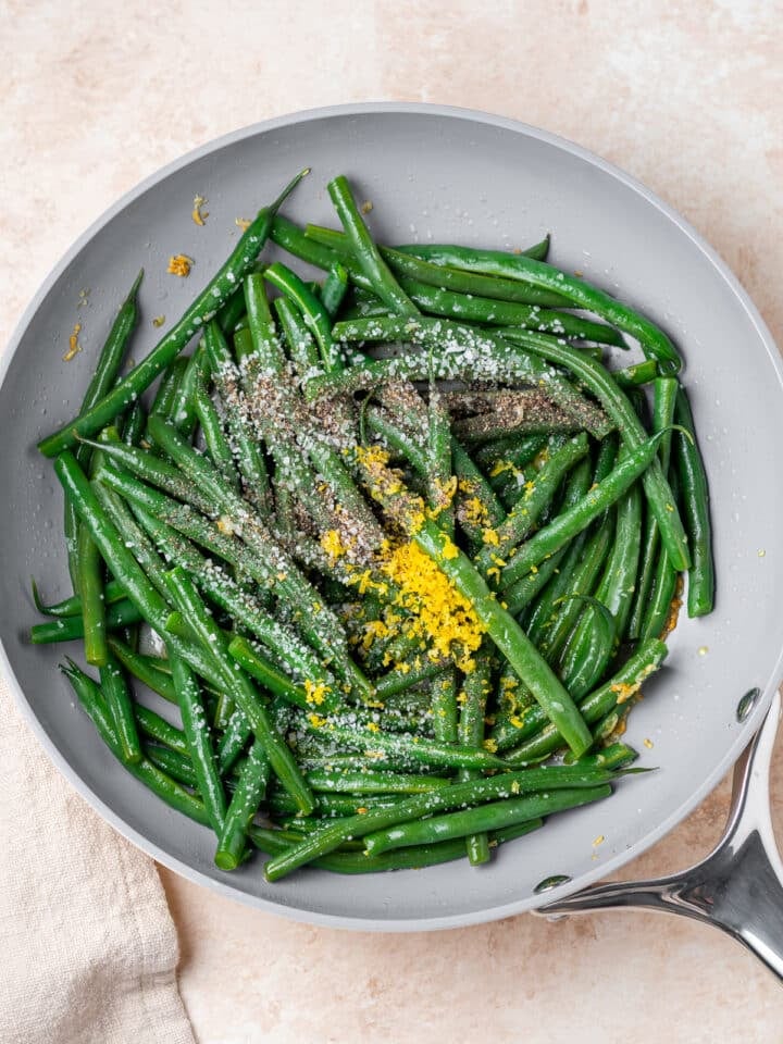 lemon zest, salt and pepper tossed in with the green beans and garlic butter