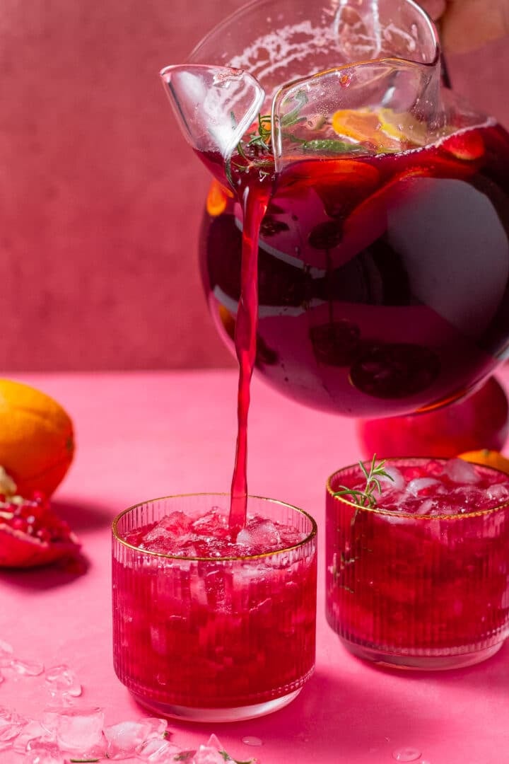 pouring juice into glasses with ice