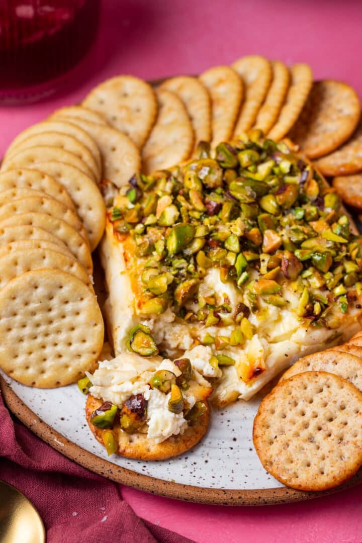 feta cheese and pistachios on a cracker