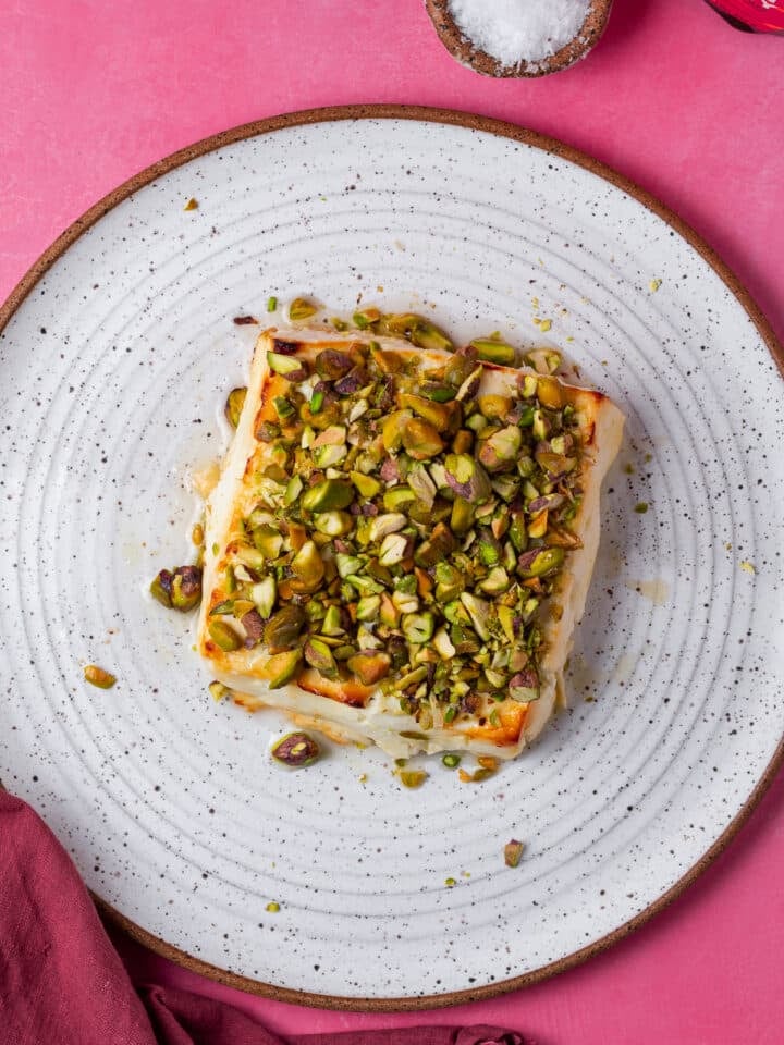block of feta topped with chopped pistachios