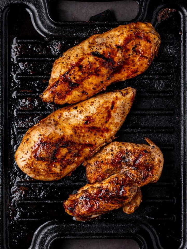 grilling chicken breast on a cast iron indoor grill