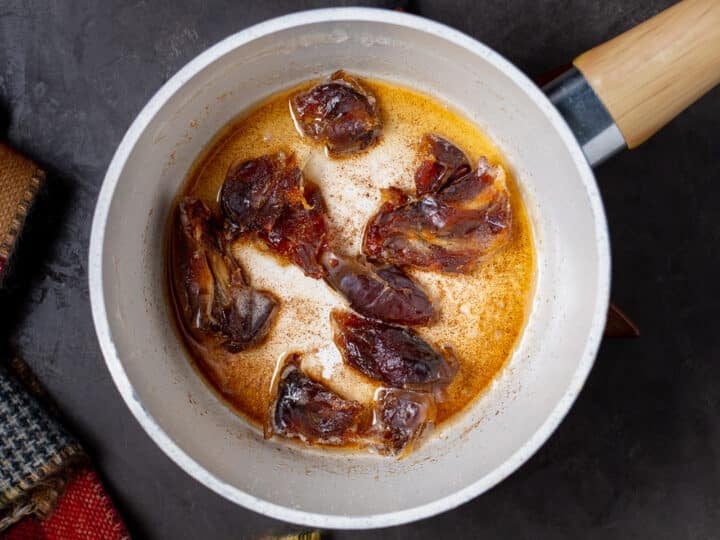 small saucepan with torn dates in browned butter