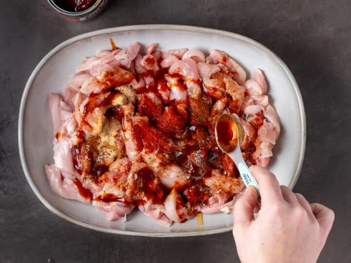 honey and chipotle sauce added to raw chicken strips