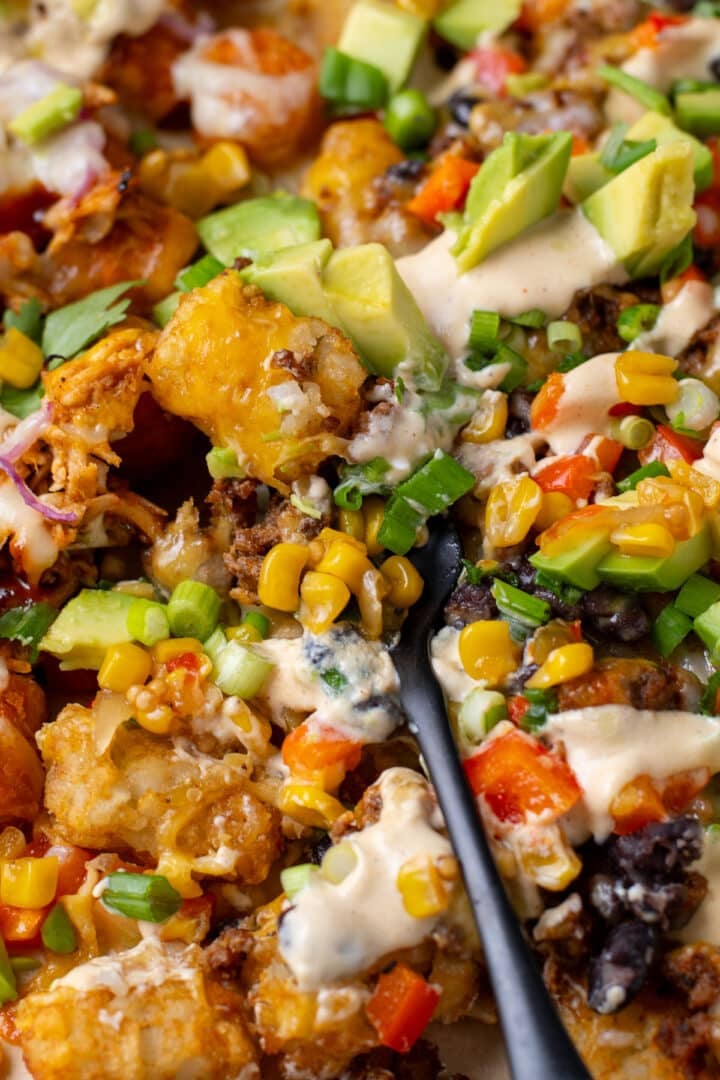 bite of ground beef and potato totchos on a fork