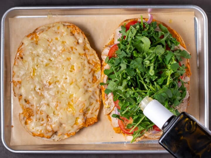 arugula added to the sandwich and drizzled with olive oil