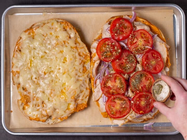 seasoned tomatoes added to the sandwich after it was baked to melt the cheese