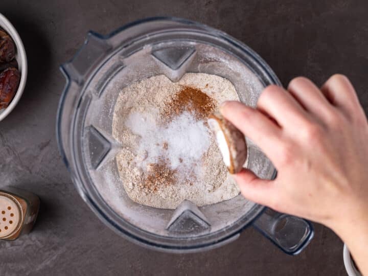baking soda and cinnamon added to oat flour in a blender