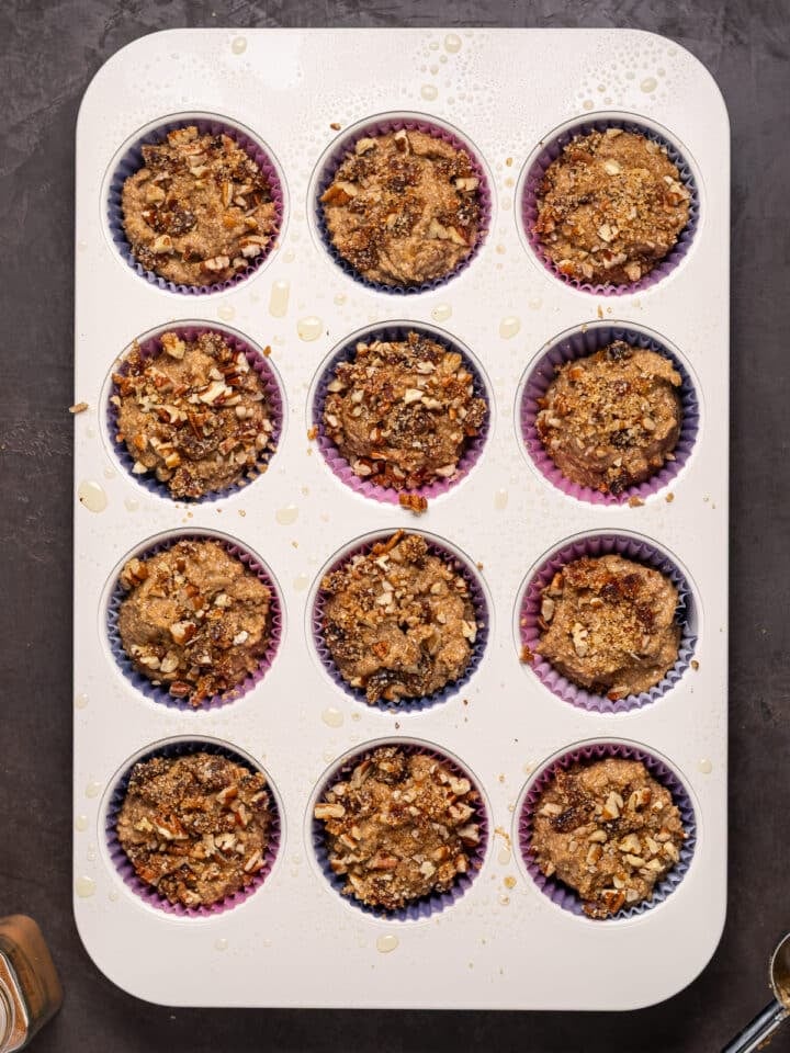 muffin tin with pecan date crumble topping