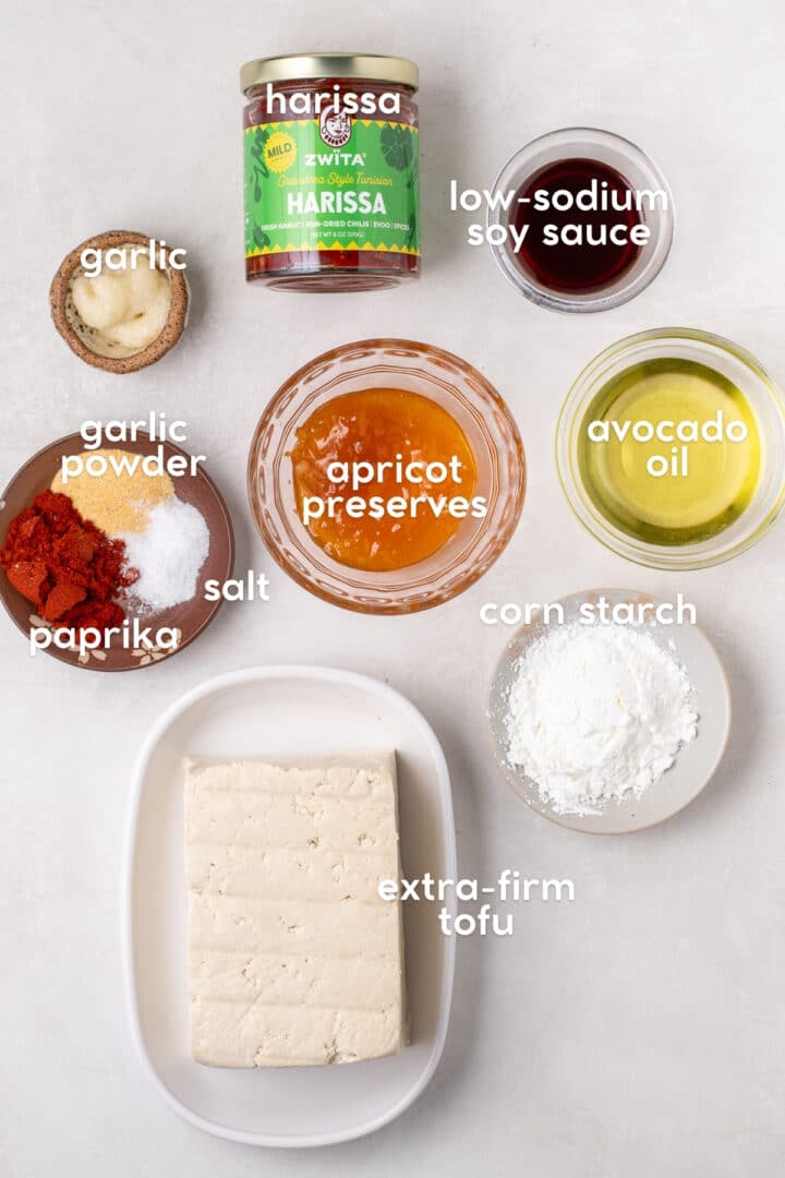 ingredients for apricot harissa tofu including extra-firm tofu, harissa, apricot preserves, soy sauce, garlic and spices