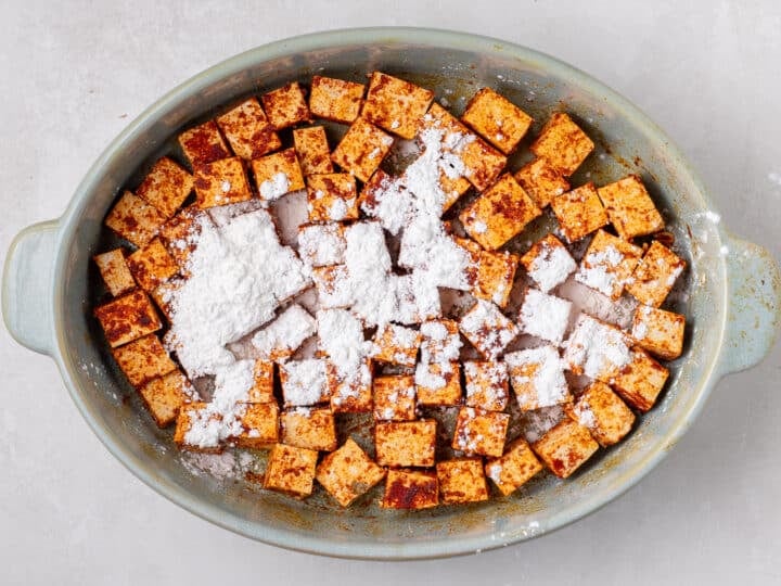 seasoned tofu cubes tossed with cornstarch to help them crisp