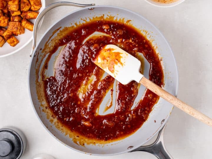 apricot sauce simmering in a skillet until thick and glossy