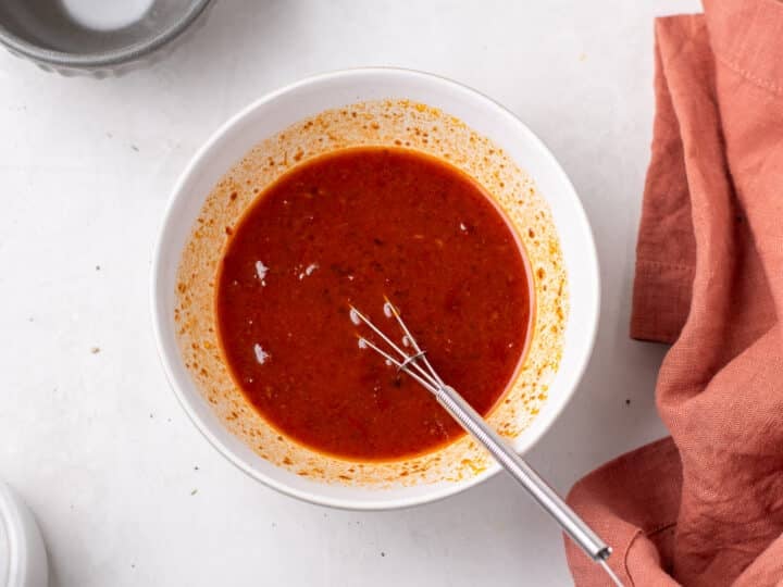 apricot harissa sauce mixture whisked together in a small bowl