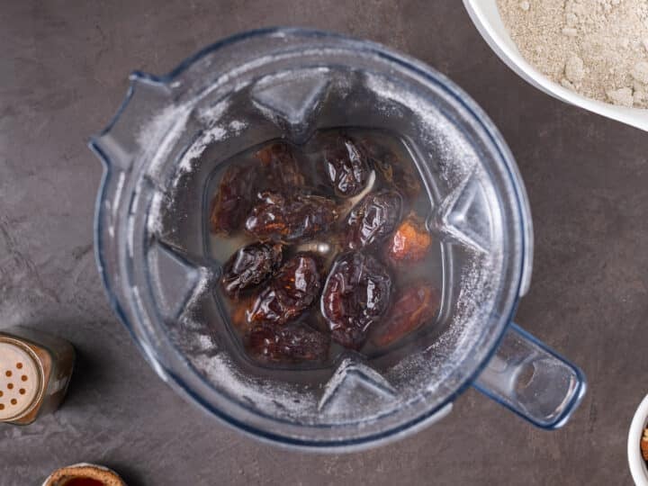 dates covered in water in a blender