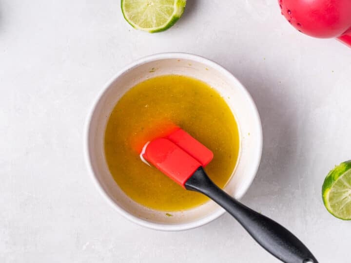 Mixing sauce in a bowl until smooth and combined