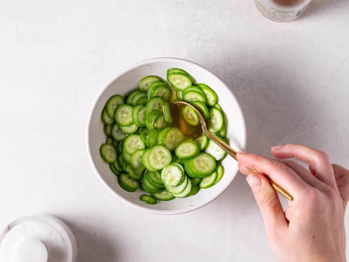 Sliced cucumbers tossed in rice vinegar, sugar, and salt for quick pickled cucumbers