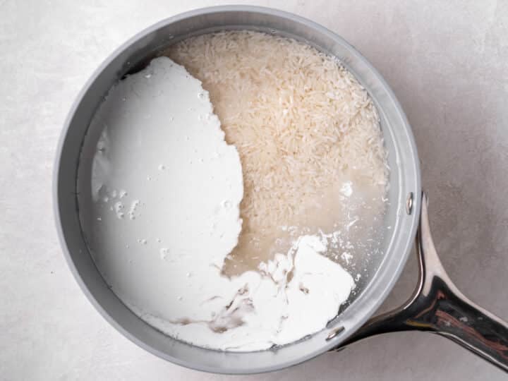 Jasmine rice with coconut milk and water in a saucepan before cooking